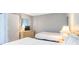 Bedroom displaying two beds, dresser with TV, and natural light from the window at 5523 N Ocean Blvd. # 1410, Myrtle Beach, SC 29577
