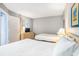 Bedroom showing two beds, a TV on a dresser, and a window at 5523 N Ocean Blvd. # 1410, Myrtle Beach, SC 29577