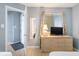 Bedroom boasts a dresser with a TV, a mirror, and an open doorway at 5523 N Ocean Blvd. # 1410, Myrtle Beach, SC 29577