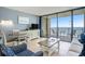Living area with a view, tiled floors, and balcony access, perfect for relaxing and entertaining at 5523 N Ocean Blvd. # 1410, Myrtle Beach, SC 29577
