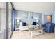 Bright living area with cozy seating, decor, and balcony access overlooking the ocean at 5523 N Ocean Blvd. # 1410, Myrtle Beach, SC 29577