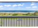 Breathtaking balcony view showcasing the ocean, beach, and distant horizon at 5601 N Ocean Blvd. # A309, Myrtle Beach, SC 29577