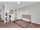 Spacious bedroom with neutral tones, adjacent bathroom, and simple furnishings at 5601 N Ocean Blvd. # A309, Myrtle Beach, SC 29577