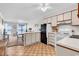 Bright kitchen seamlessly flows into the living area with a view of the balcony at 5601 N Ocean Blvd. # A309, Myrtle Beach, SC 29577