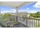 Relaxing balcony featuring a chaise lounge with a view of the condominium complex and parking at 5801 Oyster Catcher Dr. # 431, North Myrtle Beach, SC 29582