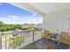 Balcony view of the condominium complex with seating for two at 5801 Oyster Catcher Dr. # 431, North Myrtle Beach, SC 29582