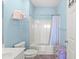 Clean bathroom featuring a shower with curtain, commode, and towel racks at 5801 Oyster Catcher Dr. # 431, North Myrtle Beach, SC 29582