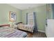 Bedroom with two twin beds featuring colorful quilts and a window with natural light at 5801 Oyster Catcher Dr. # 431, North Myrtle Beach, SC 29582
