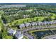 Scenic aerial view of condo community overlooking golf course, pond, and lush greenery at 605 Waterway Village Blvd. # 31A, Myrtle Beach, SC 29579