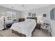 Well-lit bedroom featuring a large bed, ceiling fan, desk, and neutral decor at 605 Waterway Village Blvd. # 31A, Myrtle Beach, SC 29579