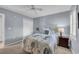 Cozy bedroom features a floral bedspread, wood bedside table, and neutral carpet at 605 Waterway Village Blvd. # 31A, Myrtle Beach, SC 29579