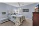 Comfortable bedroom with blue walls, a floral bedspread, and natural light at 605 Waterway Village Blvd. # 31A, Myrtle Beach, SC 29579