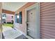 Exterior entryway featuring a screen door, blue shutters, and a glimpse of neighboring units at 605 Waterway Village Blvd. # 31A, Myrtle Beach, SC 29579