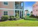 Exterior view of condo building with screened patios and well-kept lawn at 605 Waterway Village Blvd. # 31A, Myrtle Beach, SC 29579