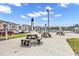 Well-maintained community amenities, including picnic tables, with lush landscaping at 605 Waterway Village Blvd. # 31A, Myrtle Beach, SC 29579