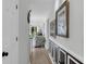 Bright hallway with decorative wall paneling and artwork leading into the living area with ample natural light at 605 Waterway Village Blvd. # 31A, Myrtle Beach, SC 29579