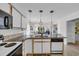 Open kitchen area with granite countertops and a view into the living room at 605 Waterway Village Blvd. # 31A, Myrtle Beach, SC 29579