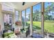 Bright sunroom featuring wicker furniture, lots of natural light, and verdant outdoor views at 605 Waterway Village Blvd. # 31A, Myrtle Beach, SC 29579
