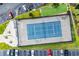 Aerial view of a well-maintained tennis court adjacent to parking and landscaped areas at 605 Waterway Village Blvd. # 31A, Myrtle Beach, SC 29579