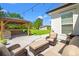 Inviting backyard patio with outdoor seating, a charming pergola kitchen, and well manicured lawn at 609 Mccown Dr., Conway, SC 29526