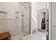 Luxurious bathroom featuring a glass-enclosed marble shower and stylish tile flooring at 609 Mccown Dr., Conway, SC 29526