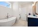 Modern bathroom with a freestanding tub, double vanity, and luxury finishes at 609 Mccown Dr., Conway, SC 29526