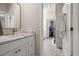 Elegant bathroom with marble countertops, a modern sink, and stylish storage at 609 Mccown Dr., Conway, SC 29526