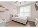 Cozy bedroom with a large window, light-colored walls, and built-in shelves at 609 Mccown Dr., Conway, SC 29526