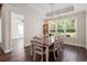 Elegant dining room with wood floors, white trim, and a large window with natural light at 609 Mccown Dr., Conway, SC 29526