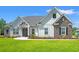 Charming home with white siding, stone accents, manicured lawn, and inviting front entrance at 609 Mccown Dr., Conway, SC 29526