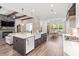 Open-concept kitchen with a large island, farmhouse sink, and view into the living room at 609 Mccown Dr., Conway, SC 29526