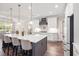 Modern kitchen with a large island, white cabinets, and stainless steel appliances at 609 Mccown Dr., Conway, SC 29526