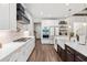 Well-lit kitchen with white cabinets, granite countertops, and stainless steel appliances at 609 Mccown Dr., Conway, SC 29526