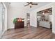 Open-concept living space with hardwood floors, a ceiling fan, and bright, neutral decor at 609 Mccown Dr., Conway, SC 29526