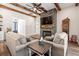 Inviting living room with a stone fireplace, hardwood floors, and plenty of natural light at 609 Mccown Dr., Conway, SC 29526