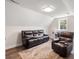 Living room area with a large leather couch, recliner, work space and natural light at 609 Mccown Dr., Conway, SC 29526