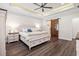 Comfortable main bedroom with a ceiling fan, wood floors, and ensuite bathroom at 609 Mccown Dr., Conway, SC 29526
