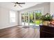 Bright sunroom with sliding glass doors and hardwood floors, offering views of the backyard at 609 Mccown Dr., Conway, SC 29526