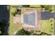 Aerial view of a house with a patio, shed, and lush greenery on a waterfront lot at 6204 Sancindy Ln., Myrtle Beach, SC 29572