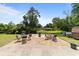 Spacious brick patio, surrounded by lush greenery, ideal for outdoor entertainment and relaxation at 6204 Sancindy Ln., Myrtle Beach, SC 29572