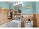 Cozy bathroom with tiled walls, a sink with storage underneath, and a vanity mirror at 6204 Sancindy Ln., Myrtle Beach, SC 29572