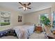 Inviting bedroom with two windows, ceiling fan, and a cozy atmosphere at 6204 Sancindy Ln., Myrtle Beach, SC 29572