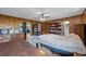 Bedroom with paneled walls, built-in bookshelves and an attached bathroom at 6204 Sancindy Ln., Myrtle Beach, SC 29572