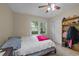 Bedroom with a fan, window, closet, and shelving unit at 6204 Sancindy Ln., Myrtle Beach, SC 29572