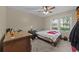 This bedroom features a ceiling fan, window and a simple decor at 6204 Sancindy Ln., Myrtle Beach, SC 29572