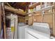 Functional utility room features a water heater, washer and dryer at 6204 Sancindy Ln., Myrtle Beach, SC 29572