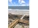 Beach access over boardwalk to a beach with walkers, ocean and beautiful sky with clouds at 6253 Catalina Dr. # 1711, North Myrtle Beach, SC 29582