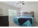 Bright bedroom with a ceiling fan, large window, and comfortable-looking bed at 6253 Catalina Dr. # 1711, North Myrtle Beach, SC 29582