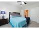 Inviting bedroom with a ceiling fan, en-suite bath, and comfortable-looking bed at 6253 Catalina Dr. # 1711, North Myrtle Beach, SC 29582