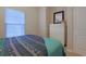 Bedroom features a large bed with patterned bedding, dresser with mirror, and window at 6253 Catalina Dr. # 1711, North Myrtle Beach, SC 29582